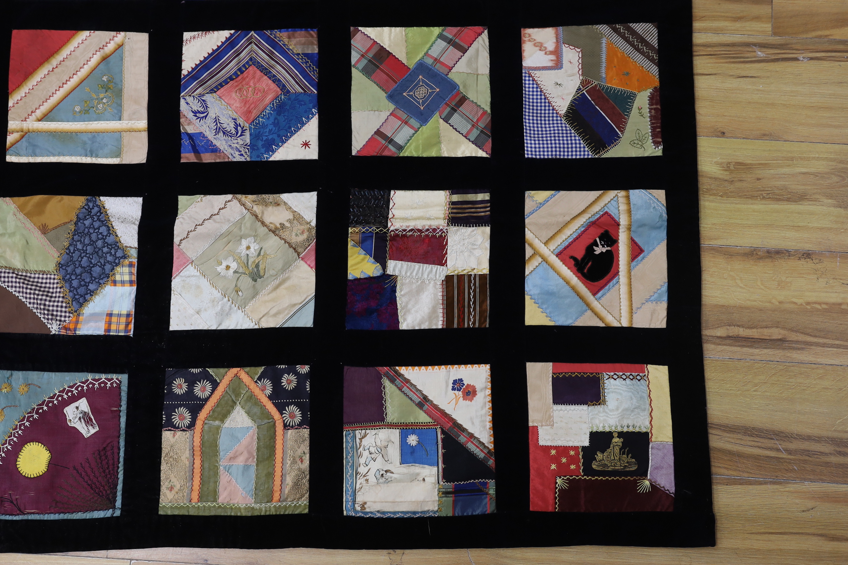 A 19th century crazy patchwork quilt worked with silks and velvets in novelty motifs